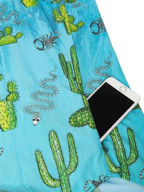 Blue cycling shorts with cactus and scorpion print, featuring phone pocket for convenience