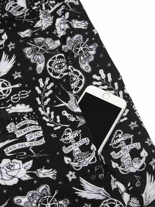Black cycling jersey with white tattoo-style graphics, anchors, butterflies, and 'Sink or Cycle' text