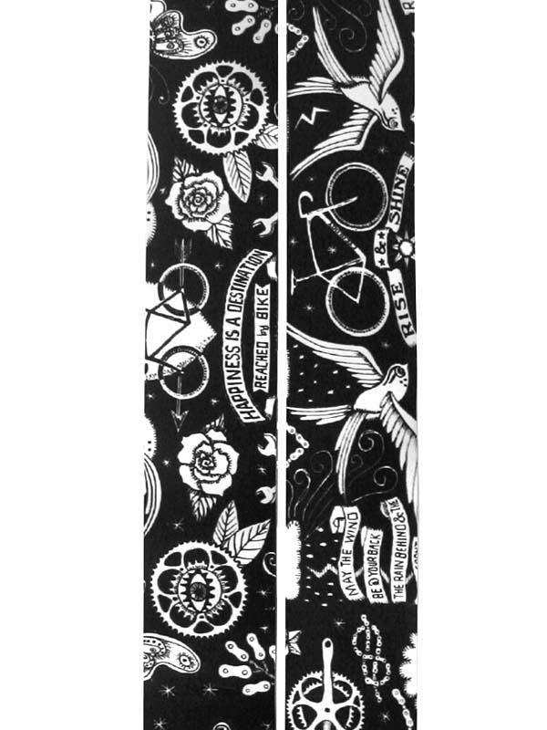 Black and white cycling-themed fabric with bikes, roses, birds, and motivational phrases for cycling apparel.