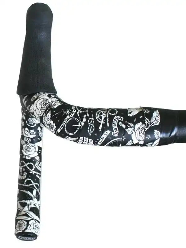 Black and white tattoo-style bike handlebar tape with roses and cycling graphics
