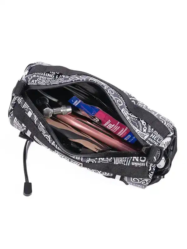 Black cycling accessory bag with white text print, holding tools and energy gels for bike rides