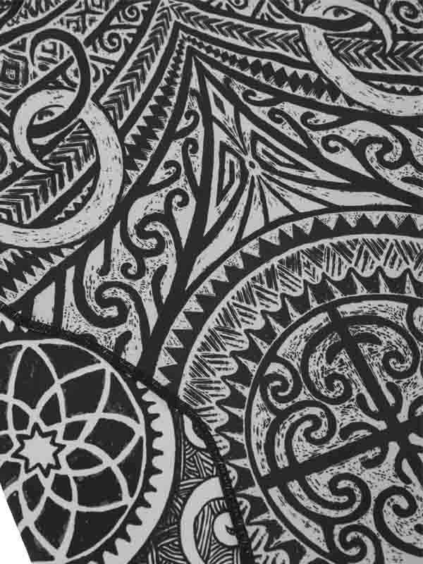 Black and white geometric cycling apparel fabric with intricate tribal patterns and gear designs